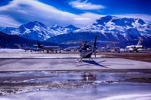 Private jets, planes and helicopters in the airport of St Moritz Switzerland