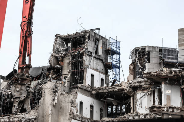 istock Building demolition by machinery for new construction. 859325344