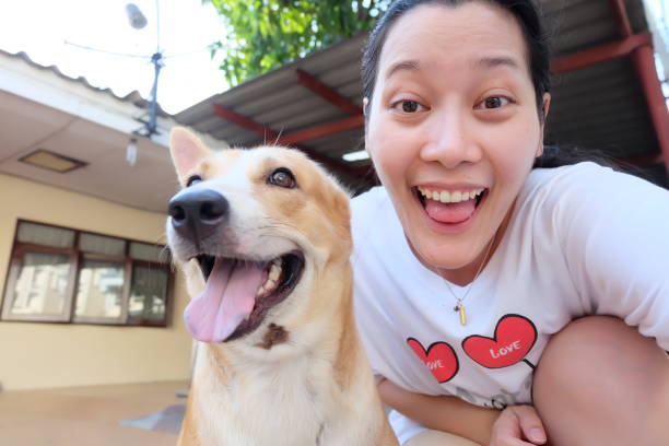 istock Asian woman selfie with dog 859325978