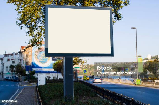 Horizontal Blank Billboard On The City Street In Background Buildings And Road With Cars Mock Up Stock Photo - Download Image Now