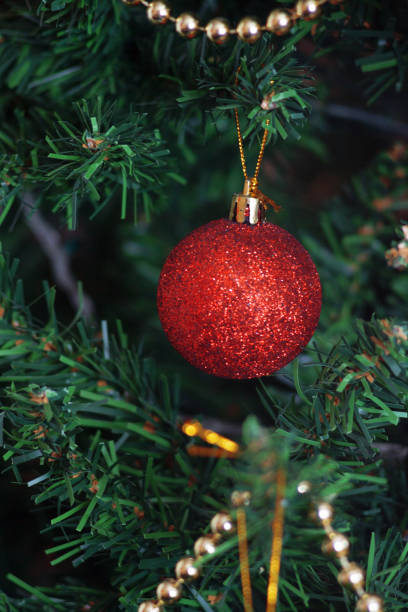 istock glass ball and decorations on Christmas tree 859336728