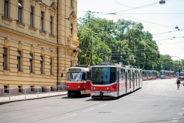 istock Prague buildings and street with red tram 859346092