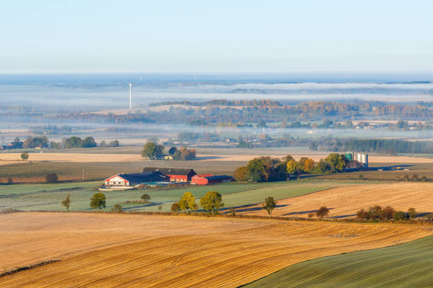 istock Countryside view with a farm in the field 859346860