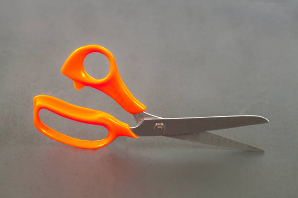 Red scissors isolated on white background.