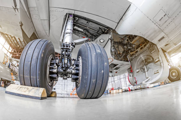 istock Landing gear airplane in hangar chassis rubber close-up. 859351692
