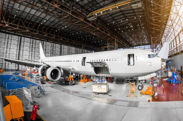 istock Large passenger aircraft in a hangar on service maintenance. 859351702