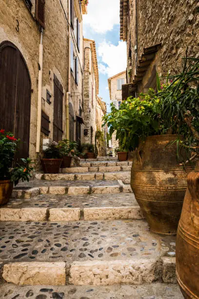 One of the many side alleys in  Saint-Paul-de-Vence in France. The village is located in the Alpes-Maritimes area of southeast france and is one of the oldest medieval towns on the French Riviera.