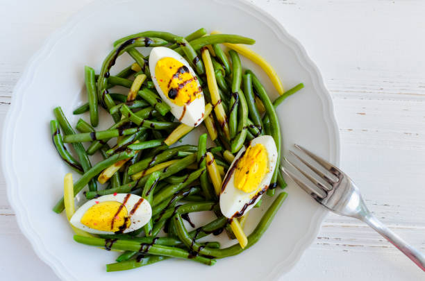 istock Warm salad with cooked green beans and boiled eggs 859364850