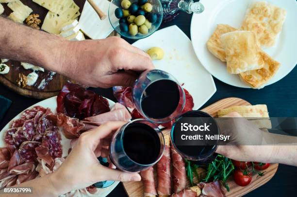 Top View Of People Toasting With Glasses Of Red Wine Stock Photo - Download Image Now