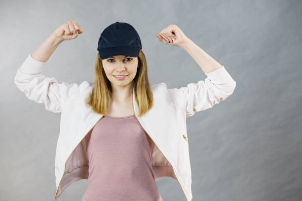 istock Young woman showing her arm muscles 859370626