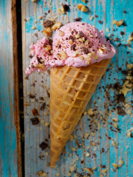 istock Strawberry Ice Cream With Chocolate and Nuts in a Waffle Cone 859371868