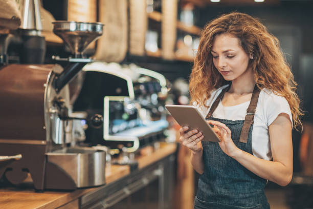 istock Beautiful barista with digital tablet 859371990