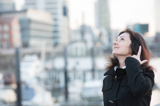 istock woman in harbor 859375070