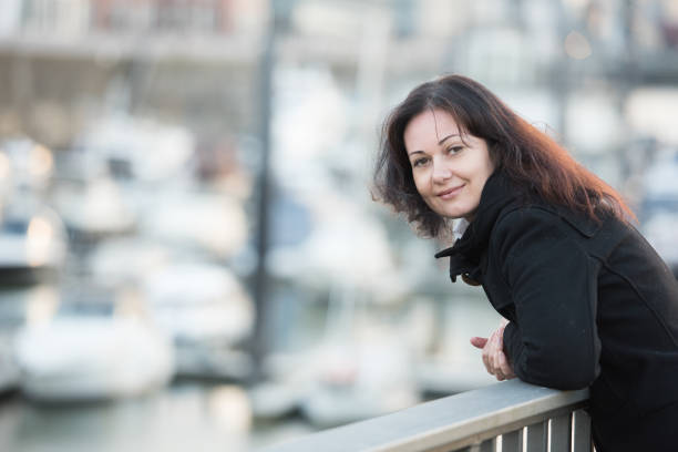 istock woman in harbor 859375110