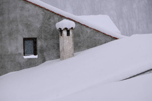 istock Snow-covered Roof and Chimney 859381184
