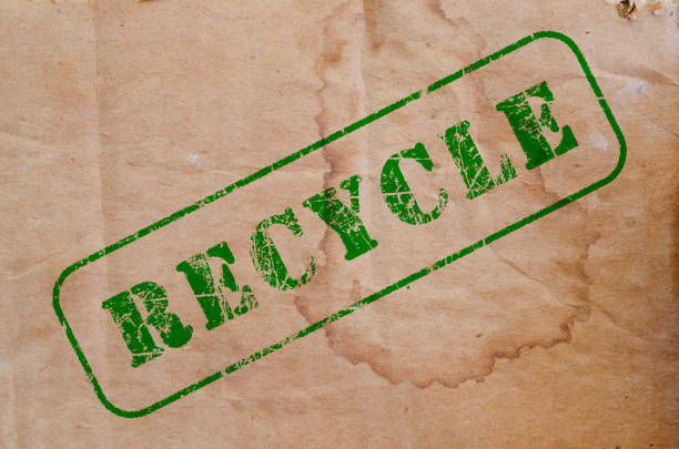 istock recycle stamp on a piece of old cardboard 859381780
