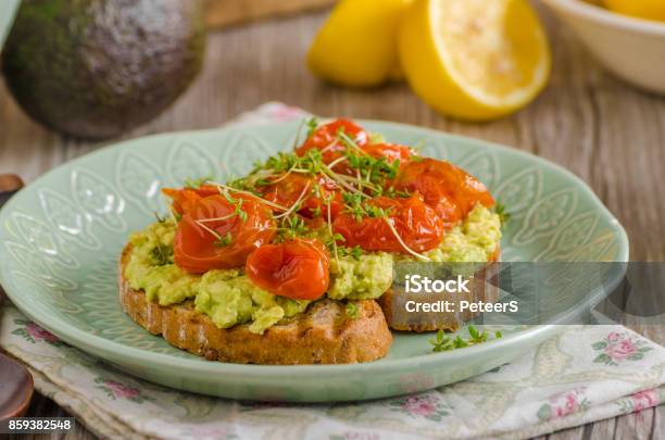 Avocado Spread With Tomatoes Stock Photo - Download Image Now - Appetizer, Avocado, Bread