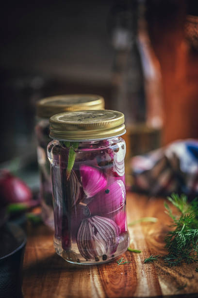 istock Preserving Organic Red Onions and Red Spring Onions in Jars 859382746