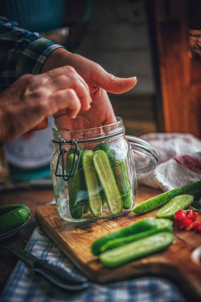 istock Preserving Organic Cucumbers in Jars 859382812