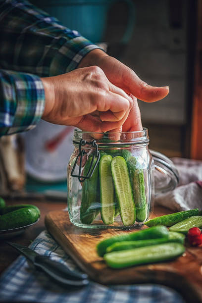 istock Preserving Organic Cucumbers in Jars 859382826