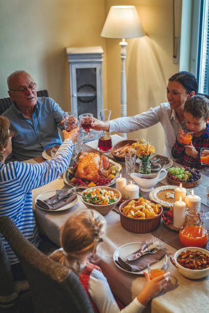 istock Family Having Traditional Holiday Stuffed Turkey Dinner 859383004