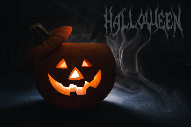 istock Halloween pumpkin head jack lantern on wooden background. 859389858