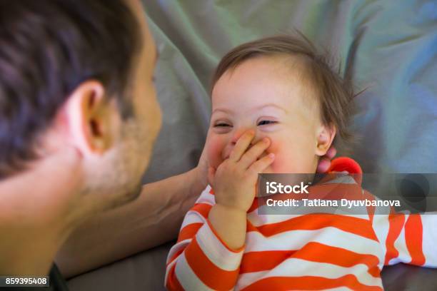 Cute Baby Boy With Down Syndrome Playing With Dad Stock Photo - Download Image Now - Baby - Human Age, Down Syndrome, Parent