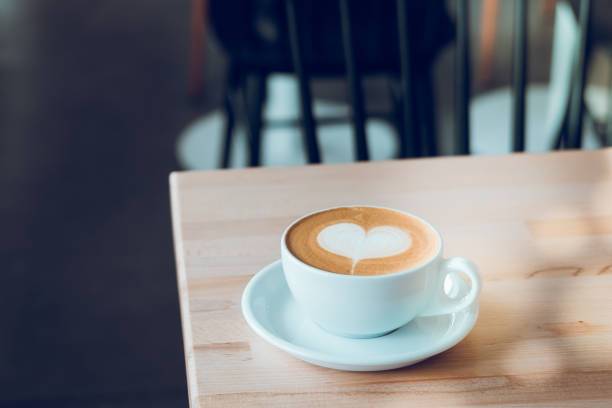 istock Cappuccino white cup with heart shaped latte art 859395930