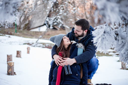 Pretty Young Couple Embracing Outdoors On Cold Winter Day