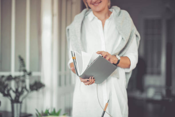 Young businesswoman is holding a personal organizer
