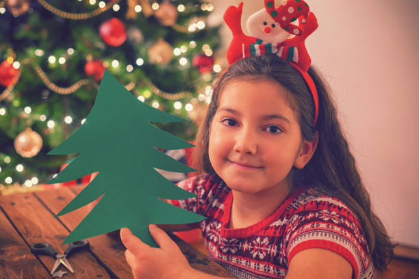 istock Little Girl Making Christmas Card 859396824