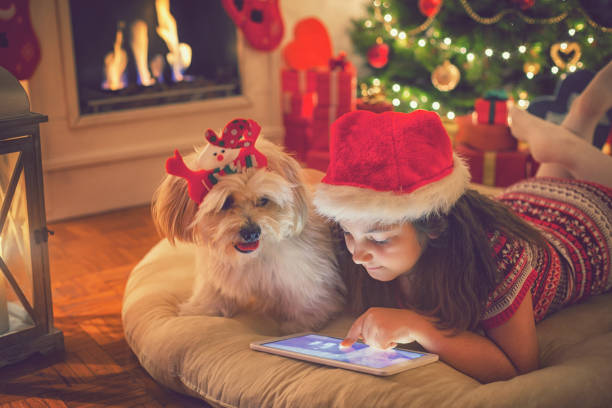 istock Beautiful little girl using digital tablet on Christmas night 859397732