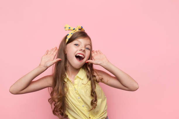 istock Charming girl calling loud on pink 859400290