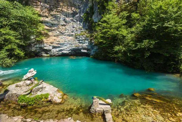 Photo of blue lake in mountains on the way to  Ritsa