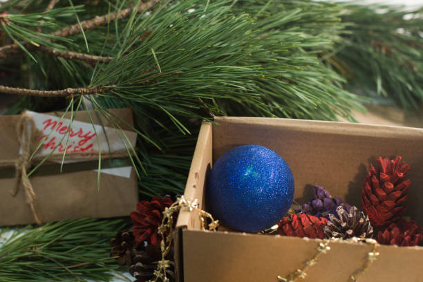 istock Festive box with decoration on Christmas tree 859406636