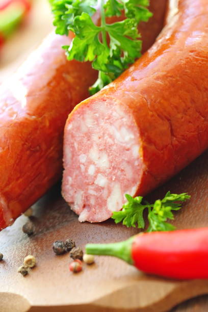 istock Smoked sausage with spices and greens 859407602
