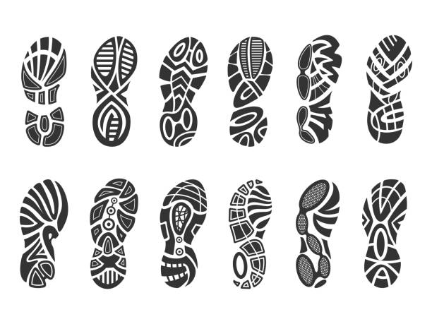 Shoes imprint set Shoes imprint set. Human footwear black track, sport and hiking trace. Vector flat style illustration isolated on white background hiking designs stock illustrations