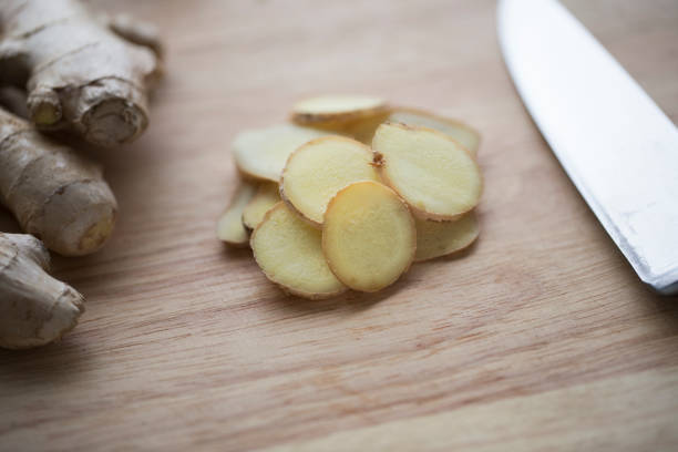 istock Close up Ginger Root Slices on Cutting Board 859410724