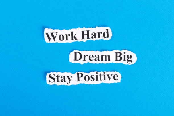 Work Hard, Dream Big, Stay Positive text on paper. Word Work Hard, Dream Big, Stay Positive on torn paper. Concept Image.