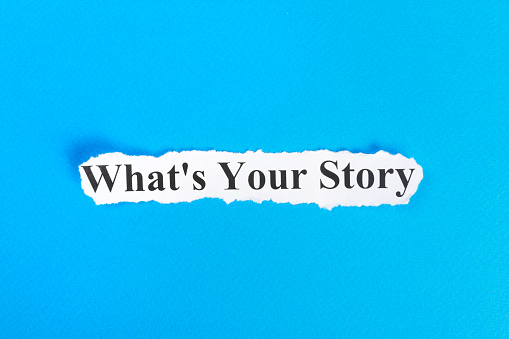 WHAT'S YOUR STORY text on paper. Word WHAT'S YOUR STORY on torn paper. Concept Image.