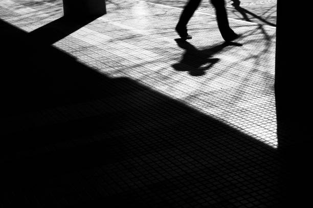 istock Blurry shadow silhouette of a man walking 859413548
