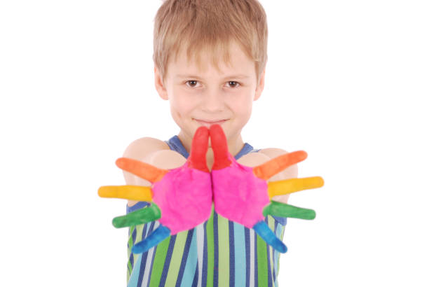 istock Beautiful little boy with hands in the paint 859417450