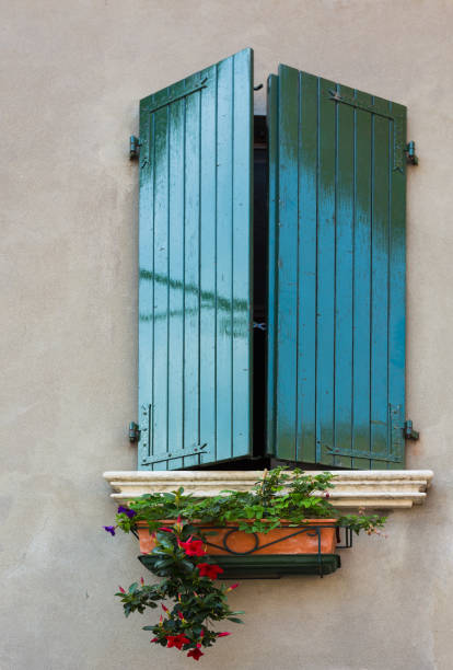 istock Window in an old house decorated with flower 859419990
