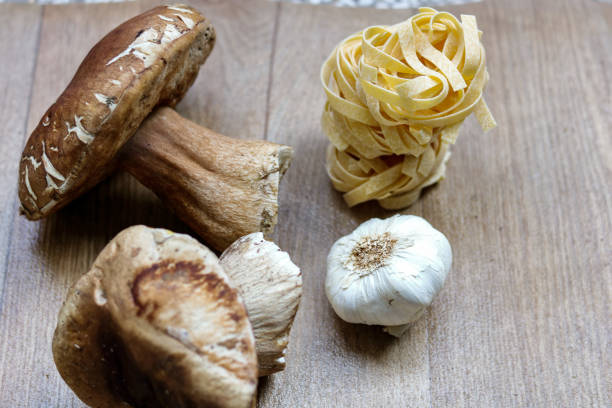 raw ingredients for italian dish, tagliatelle and porcini mushrooms