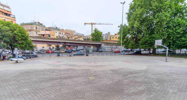 Basketball court Italy, Rome, San Lorenzo and Porta Maggiore - 08 May 2016 - basketball court in San Lorenzo, early in the morning, nobody there. san lorenzo rome photos stock pictures, royalty-free photos & images