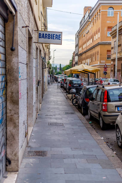 Barber shop Italy, Rome, San Lorenzo and Porta Maggiore - 08 May 2016 - Barber shop in San Lorenzo district san lorenzo rome photos stock pictures, royalty-free photos & images
