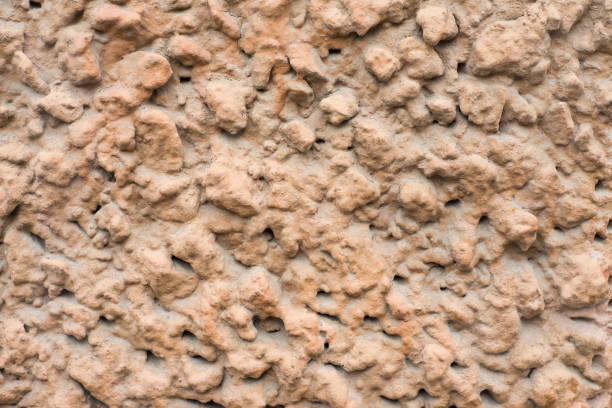 Background of the beige cement wall is plaster rough style.