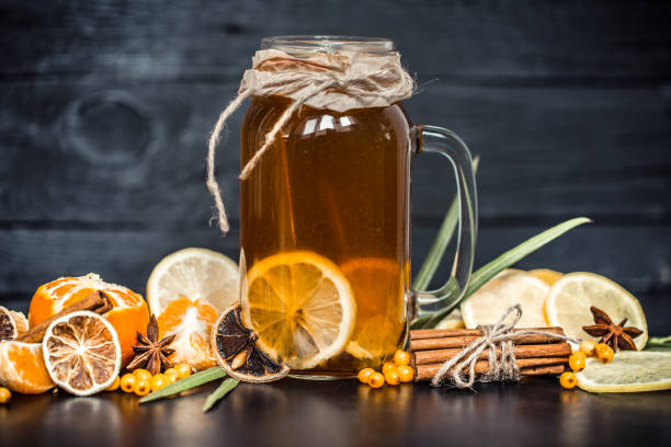 istock the composition of tea with lemon on a black background 859425280