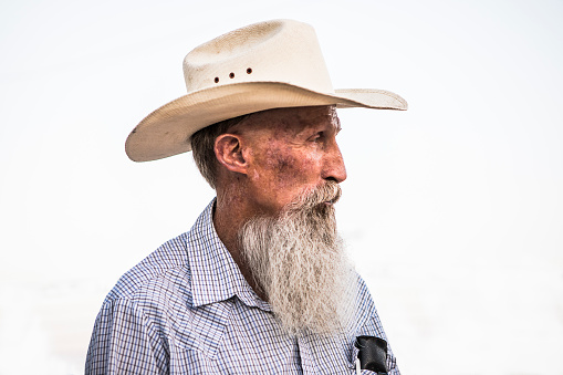 An elderly cowboy in profile.