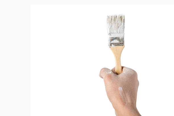 istock hand with a brush on white isolated background 859431026